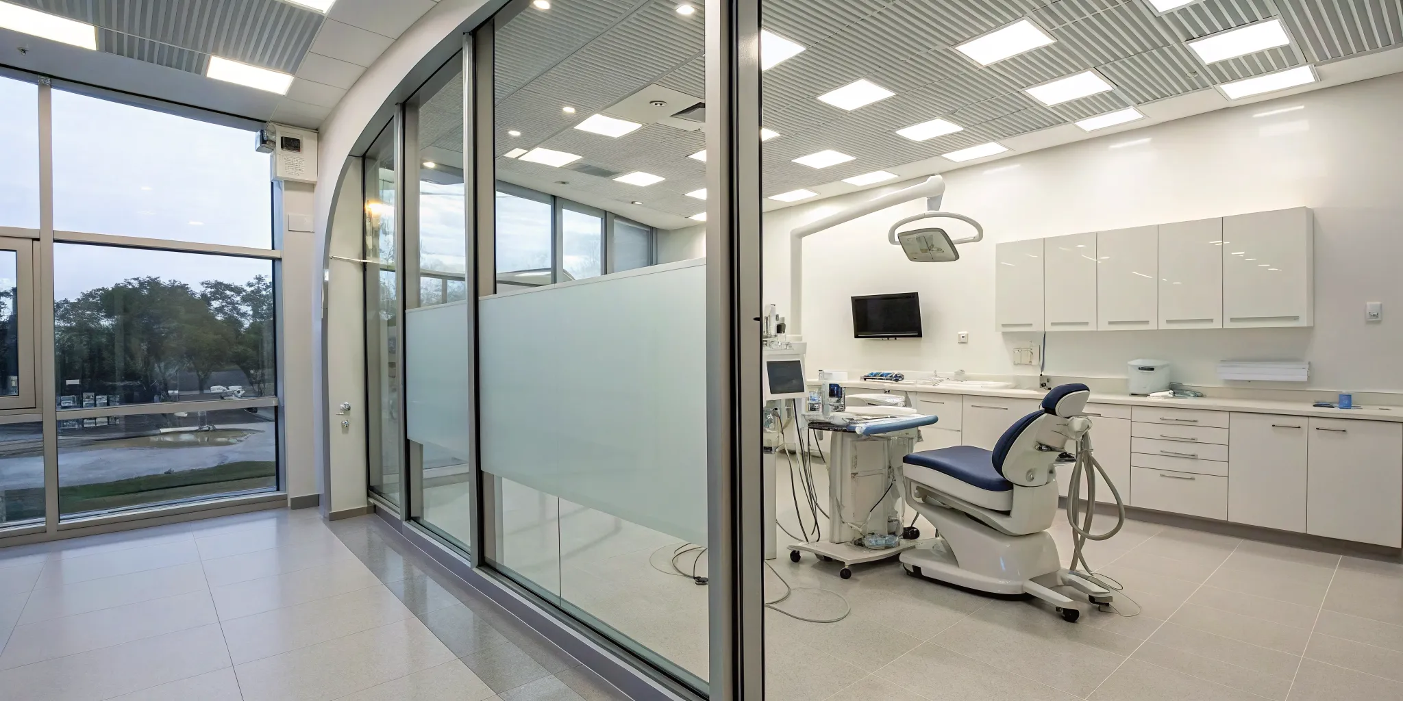 An intraoral scanner in a dental office, offered for free with lab services.